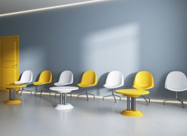 Contemporary concrete public interior with seats, coffee tables and sunlight on wall. Waiting area concept, 3D Rendering